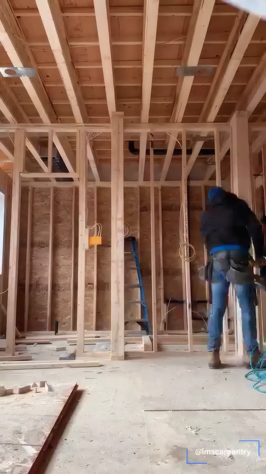 Carpenter working on framing